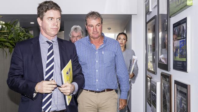 Darren Weir (centre) is seen leaving Victorian Racing Club's headquarters in February 2018. Picture: AAP Image/Daniel Pockett