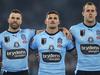 SYDNEY, AUSTRALIA - JUNE 08:  (L-R) James Tedesco, Nathan Cleary and Isaah Yeo of the Blues line up for the national anthem during game one of the 2022 State of Origin series between the New South Wales Blues and the Queensland Maroons at Accor Stadium on June 08, 2022, in Sydney, Australia. (Photo by Mark Kolbe/Getty Images)