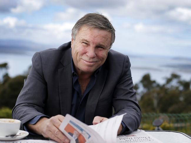 Charles Wooley reading the paper at his local cafe, the Signal Station in Mt Nelson. TasWeekend. Charles Wooley cover story