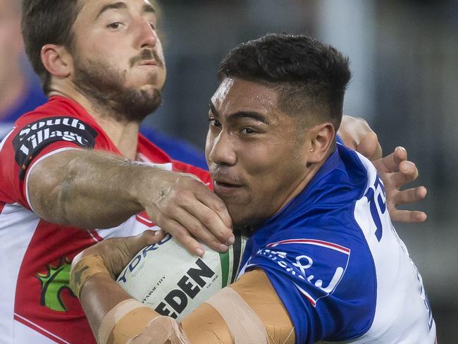 John Olive of the Bulldogs is tackled during the Round 14 NRL match between the Canterbury-Bankstown Bulldogs and the St George-Illawarra Dragons at ANZ Stadium in Sydney, Monday, June 11, 2018. (AAP Image/Craig Golding) NO ARCHIVING, EDITORIAL USE ONLY