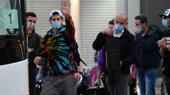 Tennis player Dominic Thiem waves as he boards the bus after arriving at Adelaide Airport on Thursday evening. Picture: Mark Brake / Getty Images