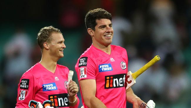 Sixers' Josh Philippe Moises Henriques all smiles after victory during the Big Bash match between the Sydney Sixers and Perth Scorchers at the SCG. Picture. Phil Hillyard