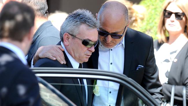 Borce Ristevski is comforted at his wife’s funeral. Picture: AAP