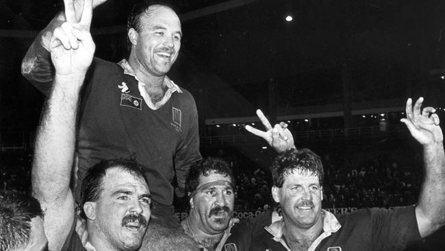 Wally Lewis being chaired off field by (L-R) RL players Martin Bella, Sam Backo and Gene Miles after the NSW v Queensland State of Origin match in 1989.