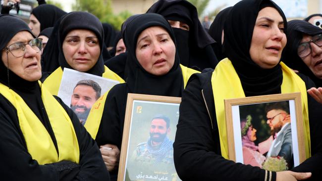 Mourners react during the funeral procession for Ali and Ibrahim Bazzi and Ibrahim’s wife Shourouk Hammoud in southern Lebanon. Picture: AFP