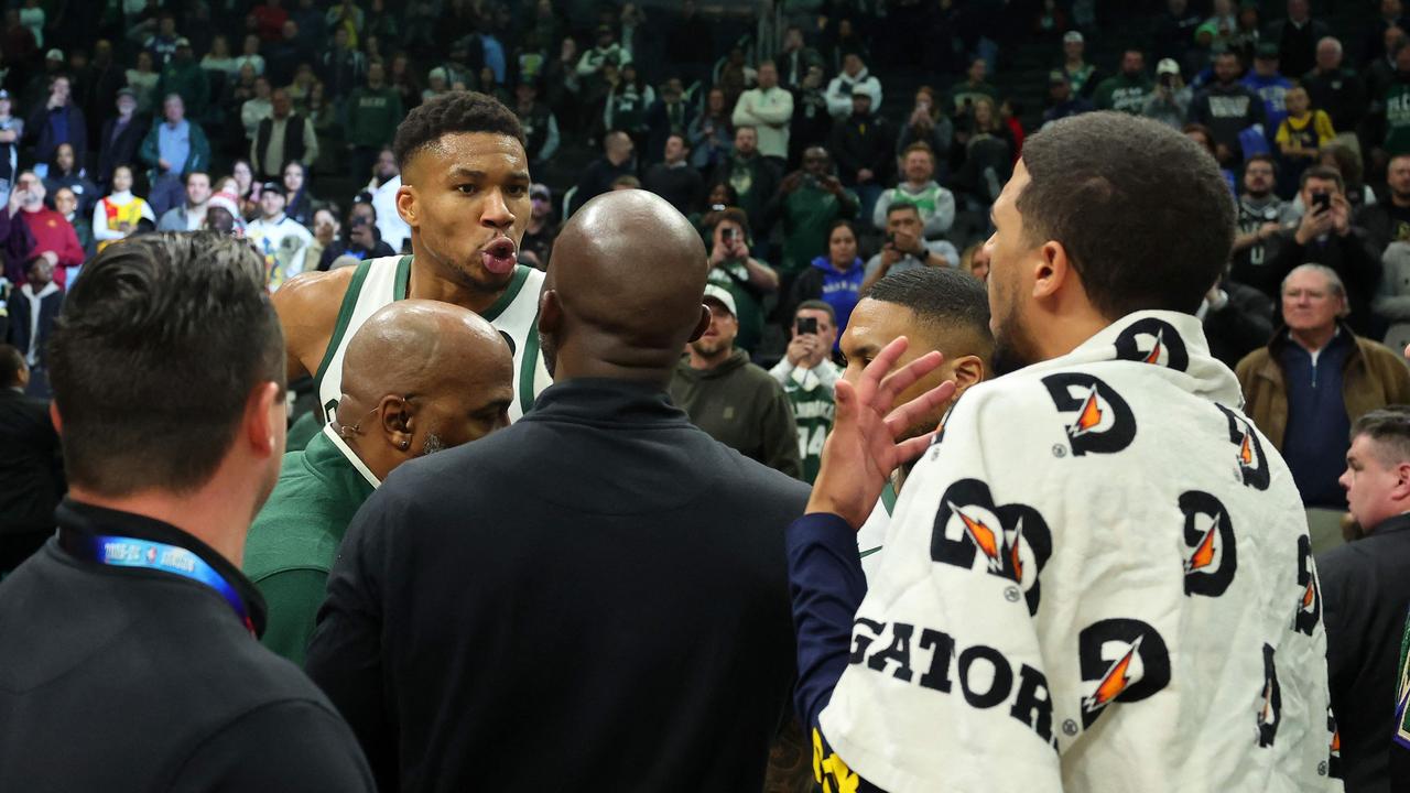 MILWAUKEE, WISCONSIN - DECEMBER 13: Giannis Antetokounmpo #34 of the Milwaukee Bucks exchanges words with Tyrese Haliburton #0 of the Indiana Pacers following a game at Fiserv Forum on December 13, 2023 in Milwaukee, Wisconsin. NOTE TO USER: User expressly acknowledges and agrees that, by downloading and or using this photograph, User is consenting to the terms and conditions of the Getty Images License Agreement. Stacy Revere/Getty Images/AFP (Photo by Stacy Revere / GETTY IMAGES NORTH AMERICA / Getty Images via AFP)