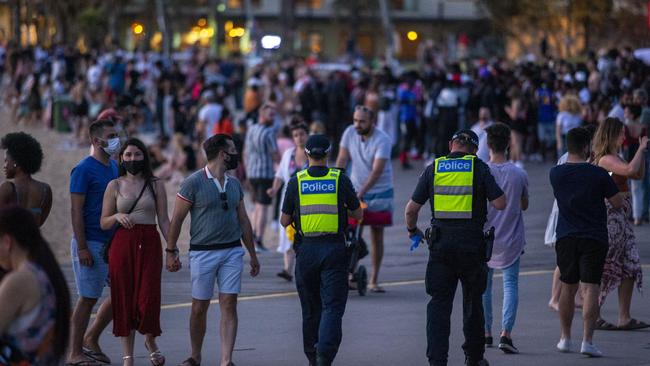 Police have desended on St Kilda beach. Picture: Wayne Taylor