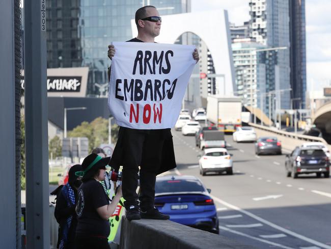 Protesters block the exit off the freeway in South Wharf. Picture: David Crosling