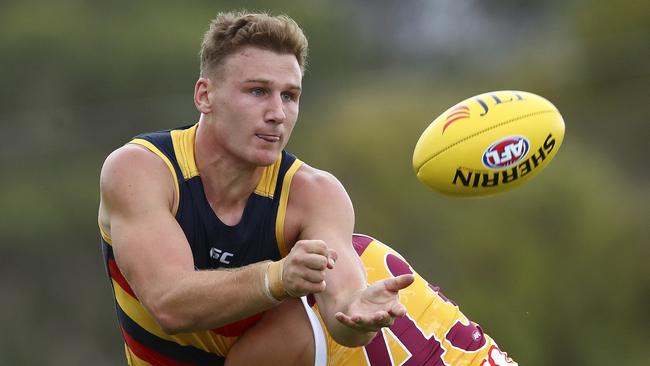 Rory Laird fires off a handball for the Crows. Picture: Sarah Reed.