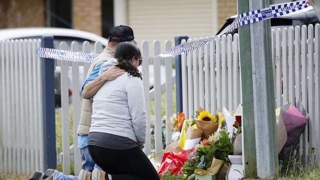 Pictured are members of the public laying flowers at 74 Chapman Parade at Faulconbridge in the Blue Mountains where two young brothers were allegedly murdered by their mother this week. Picture: Richard Dobson