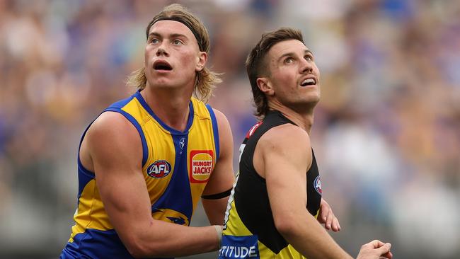 PERTH, AUSTRALIA - APRIL 14: Harley Reid of the Eagles defends Liam Baker of the Tigers during the 2024 AFL Round 05 match between the West Coast Eagles and the Richmond Tigers at Optus Stadium on April 14, 2024 in Perth, Australia. (Photo by Will Russell/AFL Photos via Getty Images)