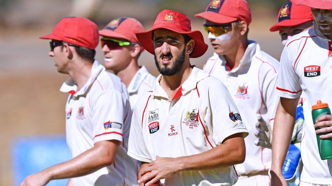 Adelaide captain Cameron Valente leads his team off the field. Picture: AAP/Mark Brake