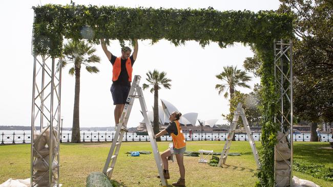 Matt Cooper of Liverpool and Taylor Hill of Cronulla working for SoldOut erecting a New Year’s Eve Welcome arch at Hickson Road reserve