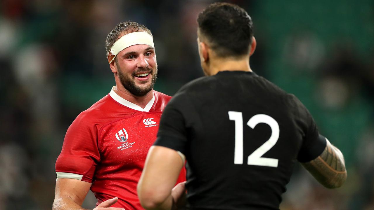 Tyler Ardron of Canada shakes hands with Sonny Bill Williams of New Zealand.