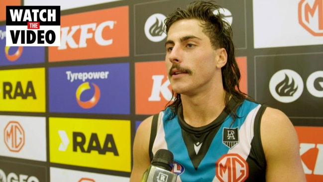 Lachie Jones reacts to his first game with Port Adelaide