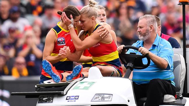 BAD BREAK: Erin Phillips (middle) is consoled by co-captain Chelsea Randall after breaking down in Adelaide’s AFLW grand final win against Carlton in March. Picture: DANIEL KALISZ (Getty Images).