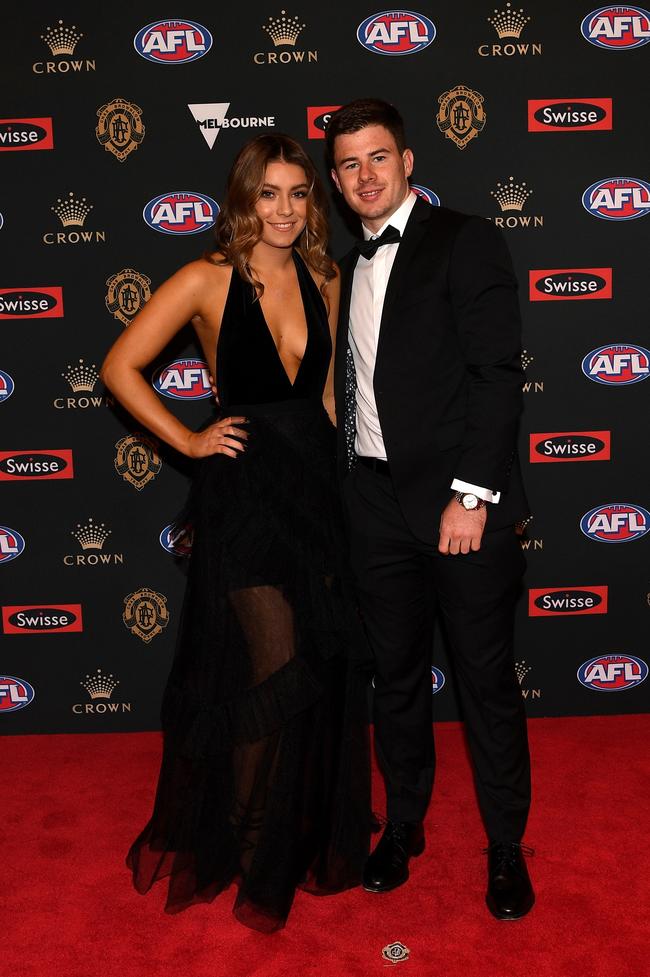 Jack Higgins of Richmond and partner Tenisha Cook. Picture: AAP