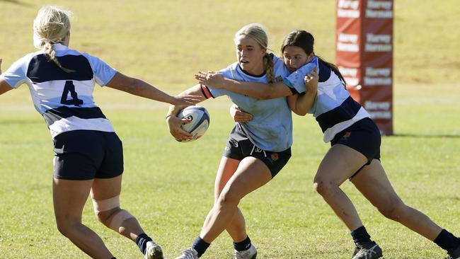 L to R: Lacey Cross from CH II, Millie Parker from CHS II with the ball and tackled by Liliana Reardon from CHS 1.