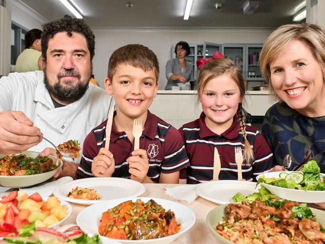 March 5, 2025: Africola head chef Duncan Welgemoed and Annesley Junior School principal Jo Rossiter serve up lunch for Year 3 students Mico and Charlotte, both 8 years old as part of the Budding Lunch program.  Picture: Brenton Edwards