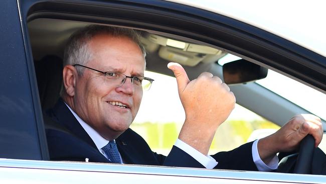 Scott Morrison behind the wheel of a hydrogen-powered car in Melbourne on Tuesday. Picture: AFP