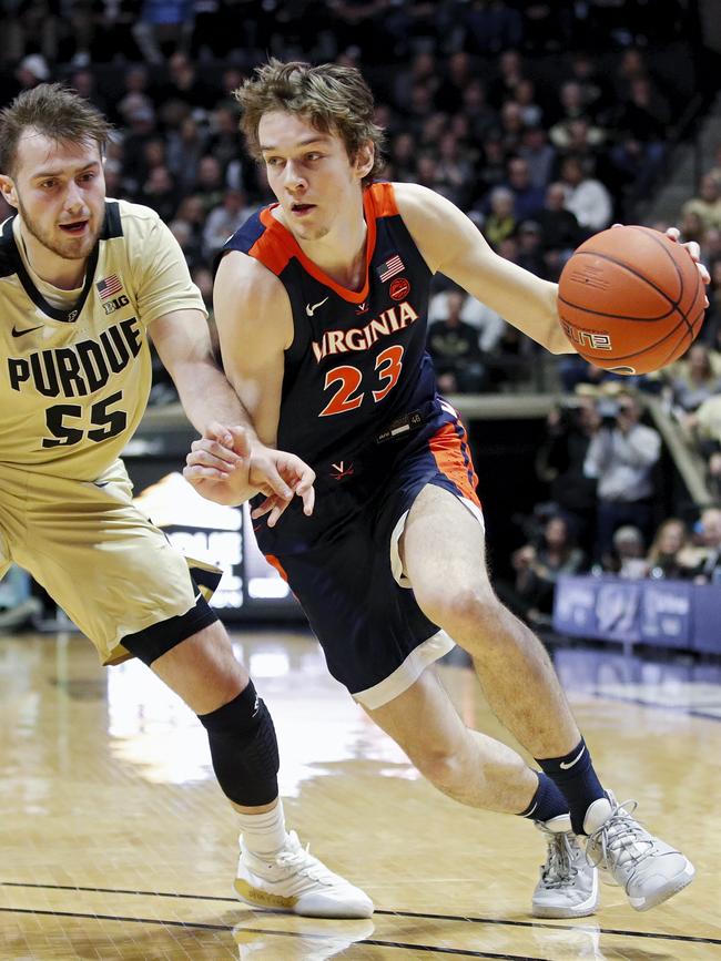 Kody Stattmann of the Virginia Cavaliers drives while defended by Sasha Stefanovic of the Purdue Boilermakers in the first half at Mackey Arena on December 4, 2019 in West Lafayette, Indiana. (Photo by Joe Robbins/Getty Images)