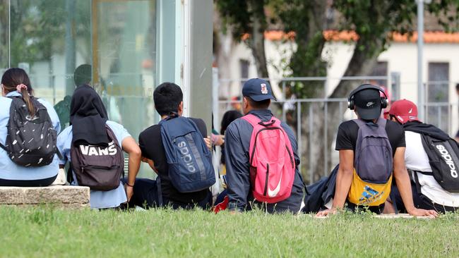 James Busby High School students wait for transport after school. Picture: Tim Hunter