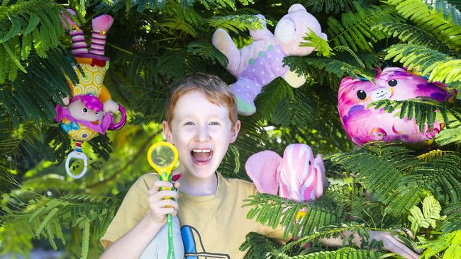 Tristan Bragg, 7, is on the hunt for teddy bears around Sandgate Picture: AAP/Renae Droop