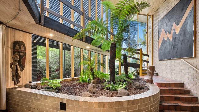 The house features an indoor tropical garden.