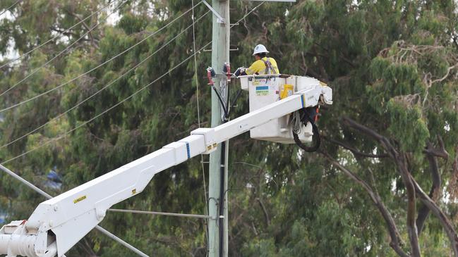 Energex workers get on with recovery efforts outside HOTA and Bundall. Picture Glenn Hampson