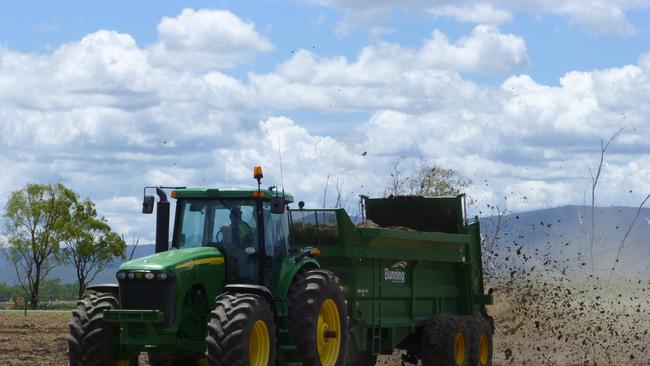 Arkwood Organic Recycling workers spread biosolids on crops for farmers. Contributed