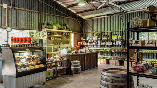 The iconic cafe and farm shed sells fresh apple products along with local produce and its famous apple pie. Pictures: Ray White
