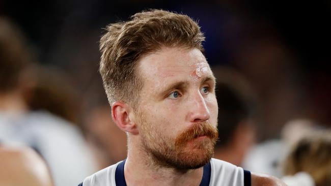 Zach Tuohy of the Cats looks on after being headbutted by Bailey Smith. Photo by Dylan Burns/AFL Photos via Getty Images