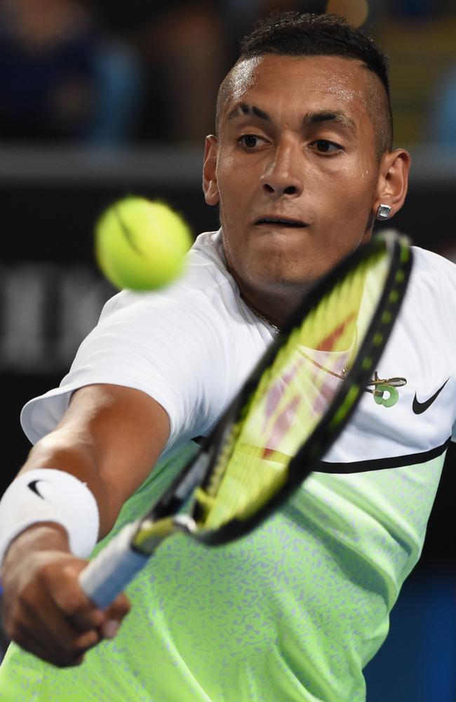 Australia's Nick Kyrgios hits a return against Argentina's Federico Delbonis.