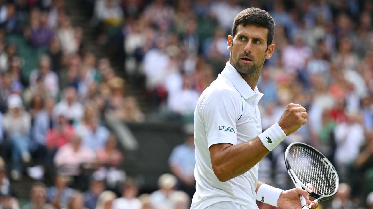 Serbia's Novak Djokovic celebrates beating Australia's Thanasi Kokkinakis at Wimbledon.