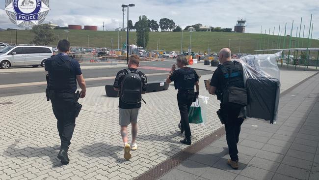 A 38-year-old Alexandria man being arrested at Hobart Airport on Thursday, November 9, 2023. Picture: AFP/ Tasmania Police