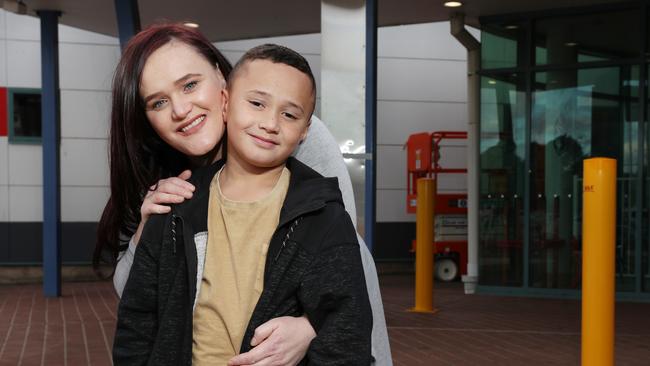 Pictured outside Campbelltown Hospital is Kathleen Warren with her son Cohen Leota-lu (8). Cohen was transferred to Randwick Hospital for surgery, meaning Kathleen had to commute to Sydney. Picture: Richard Dobson