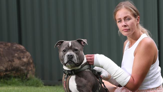 Sarah Keevers and her dog Hank the Staffordshire Terrier were savagely attacked by a dog in Biggera Waters, requiring Sarah to spend days in hospital. Picture Glenn Hampson