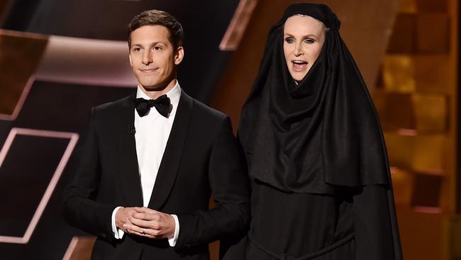 Host Andy Samberg and Jane Lynch trying to be funny on stage.