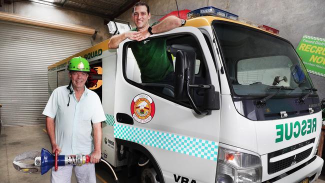 Murwillumbah resident Greg Watson joins Tweed District Rescue Squad commander Drew Carr at the volunteer organisation's headquarters at Chinderah for the presentation of a $900 donation as part of a fundraising drive for the VRA. Photo: SCOTT POWICK