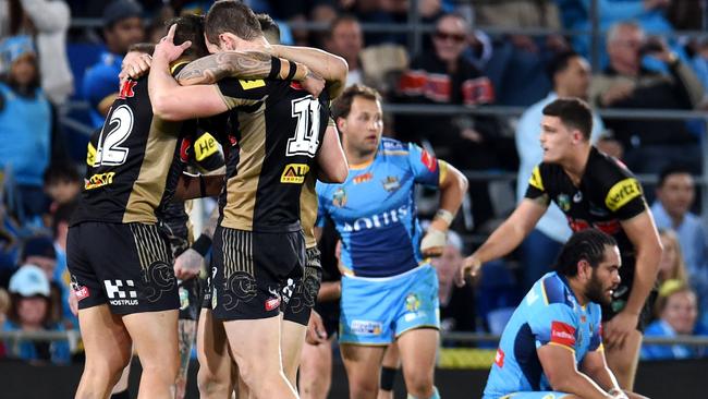 Penrith players celebrate downing the Titans.
