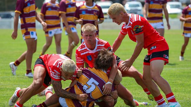 Lachlan Breed monstered in a tackle by 4 defenders. Picture: Adam Wrightson Photography