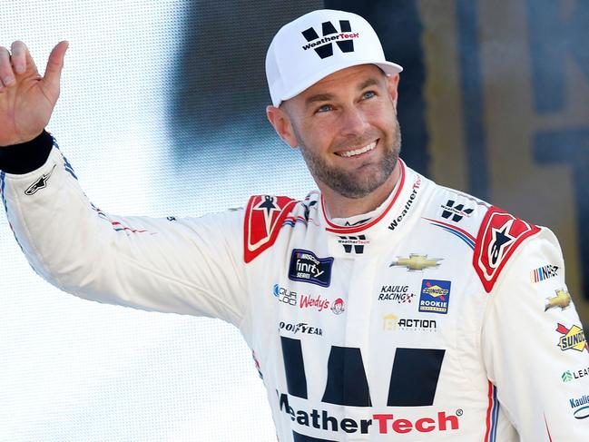 Shane van Gisbergen waves to fans in the US.