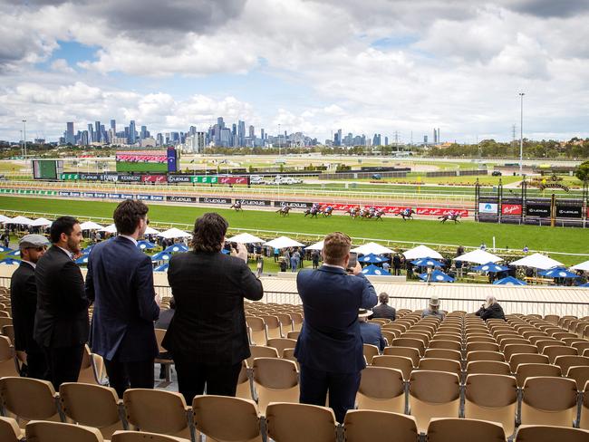 Spectators watch on. Picture: Mark Stewart