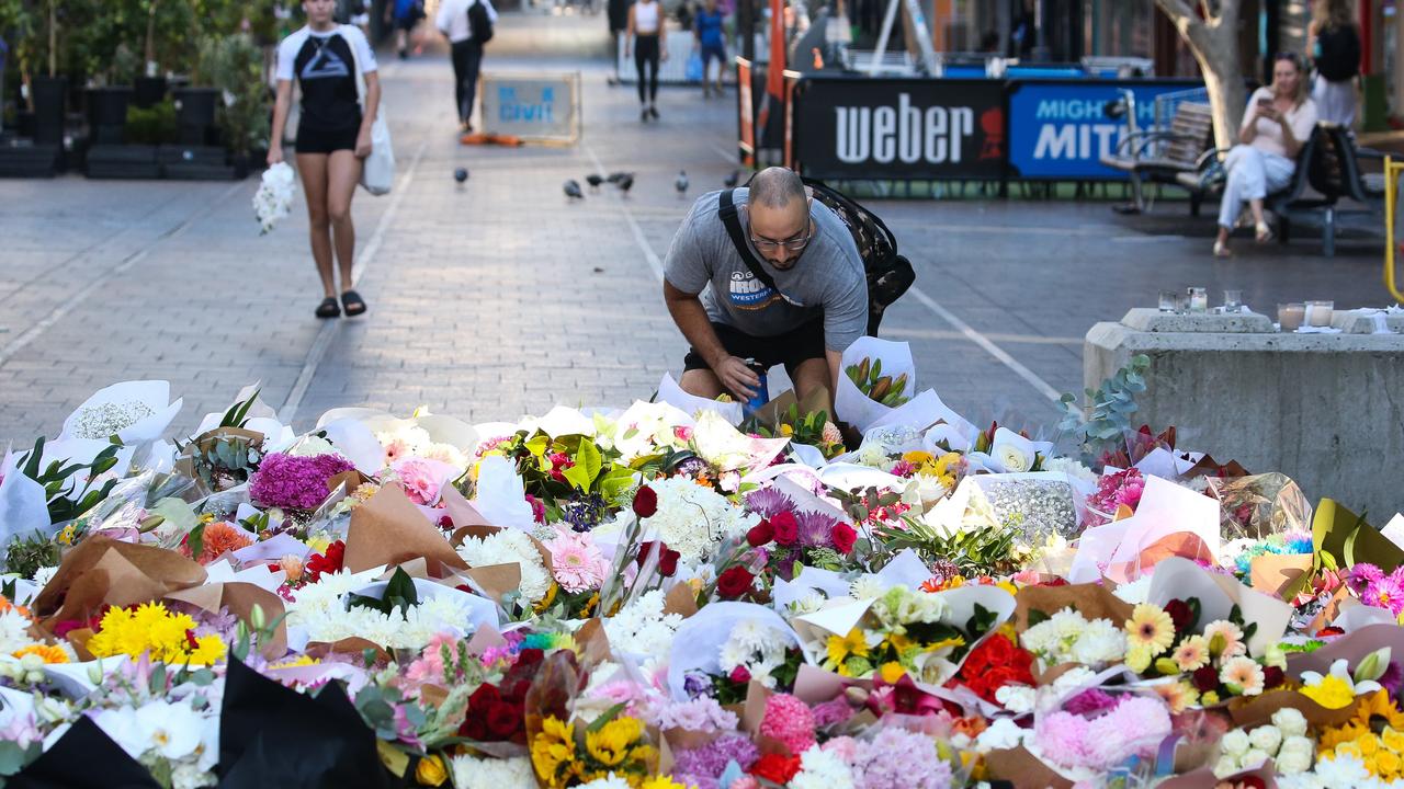 Tributes have streamed in, with a mountain of flowers decorating Bondi Junction following the deaths of six people. Picture: NCA NewsWire / Gaye Gerard