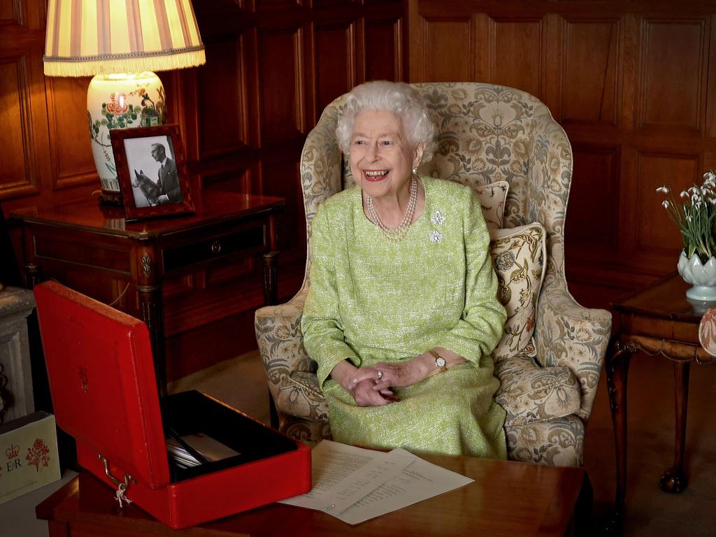 The Queen in February 2022 smiles as she sits in Sandringham House in Norfolk. Picture: Chris Jackson/Buckingham Palace/AFP