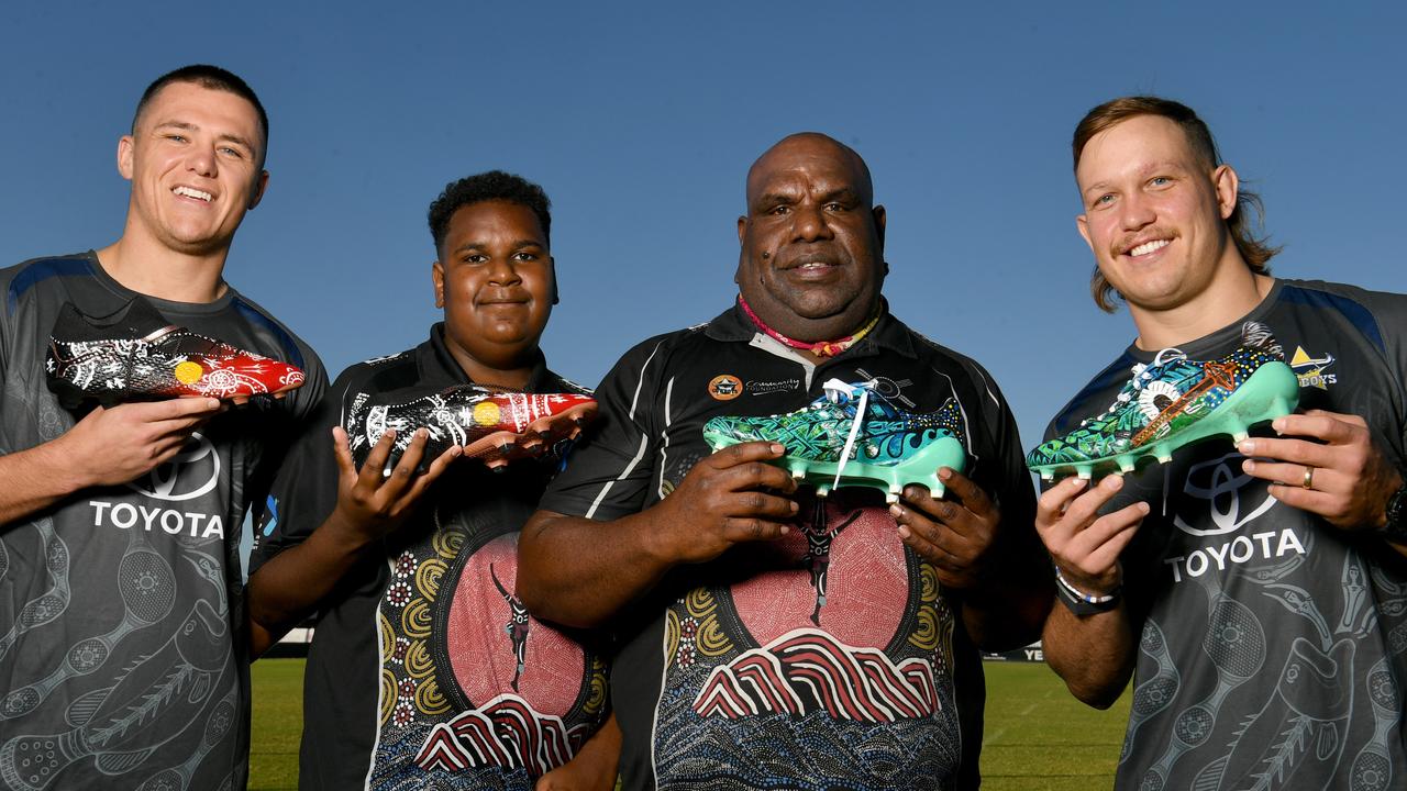 North Queensland Cowboys players Scott Drinkwater and Reuben Cotter with Cowboys House cultural coordinator Vincent Babia and student Elson Asai, 13, from Yorke Island in the Torres Strait. Picture: Evan Morgan