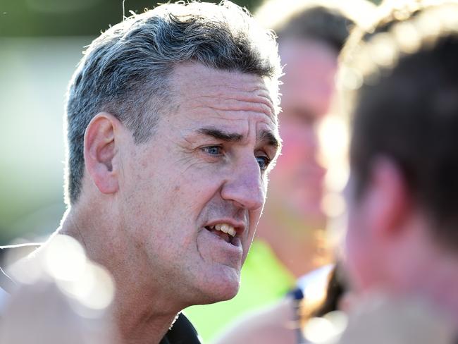 Chelsea coach Brett Dunne addresses his players at three-quarter time. Picture: Jason Sammon.