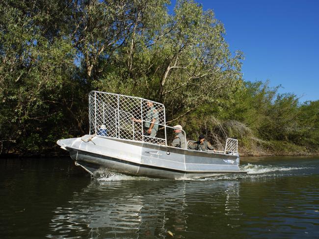 Parks and Wildlife rangers search for the remains of a 62-year-old man taken from his boat by a saltwater crocodile in the Kakadu on Sunday. Picture: Michael Franchi