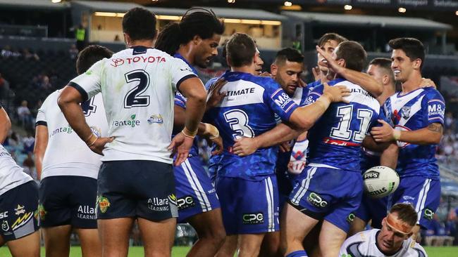 SYDNEY, AUSTRALIA - APRIL 26: Josh Jackson of the Bulldogs celebrates with teammates after scoring a try during the round 7 NRL match between the Canterbury Bulldogs and the North Queensland Cowboys at ANZ Stadium on April 26, 2019 in Sydney, Australia. (Photo by Matt King/Getty Images)