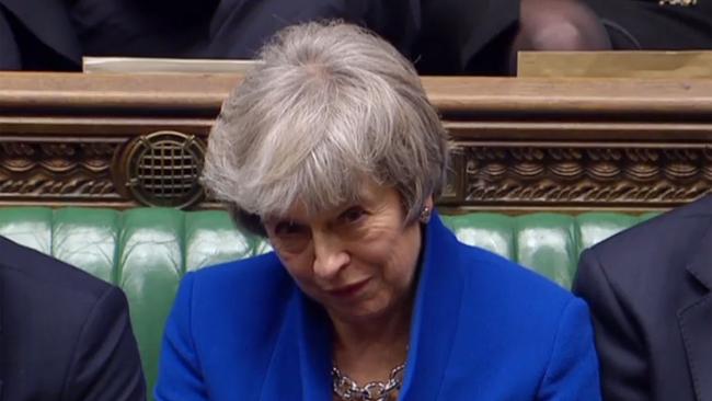 A video grab from footage broadcast by the UK Parliament's Parliamentary Recording Unit (PRU) shows Britain's Prime Minister Theresa May reacting as opposition Labour Party Leader Jeremy Corbyn makes a point of order after the result of the vote on the no confidence motion, in the House of Commons in central London on January 16, 2019. - British Prime Minister Theresa May on Wednesday survived a no-confidence vote sparked by the crushing defeat of her Brexit deal just weeks before the UK leaves the European Union. (Photo by HO / PRU / AFP) / RESTRICTED TO EDITORIAL USE - MANDATORY CREDIT " AFP PHOTO / PRU " - NO USE FOR ENTERTAINMENT, SATIRICAL, MARKETING OR ADVERTISING CAMPAIGNS